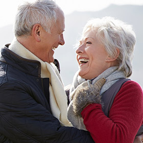 an older couple laughing together